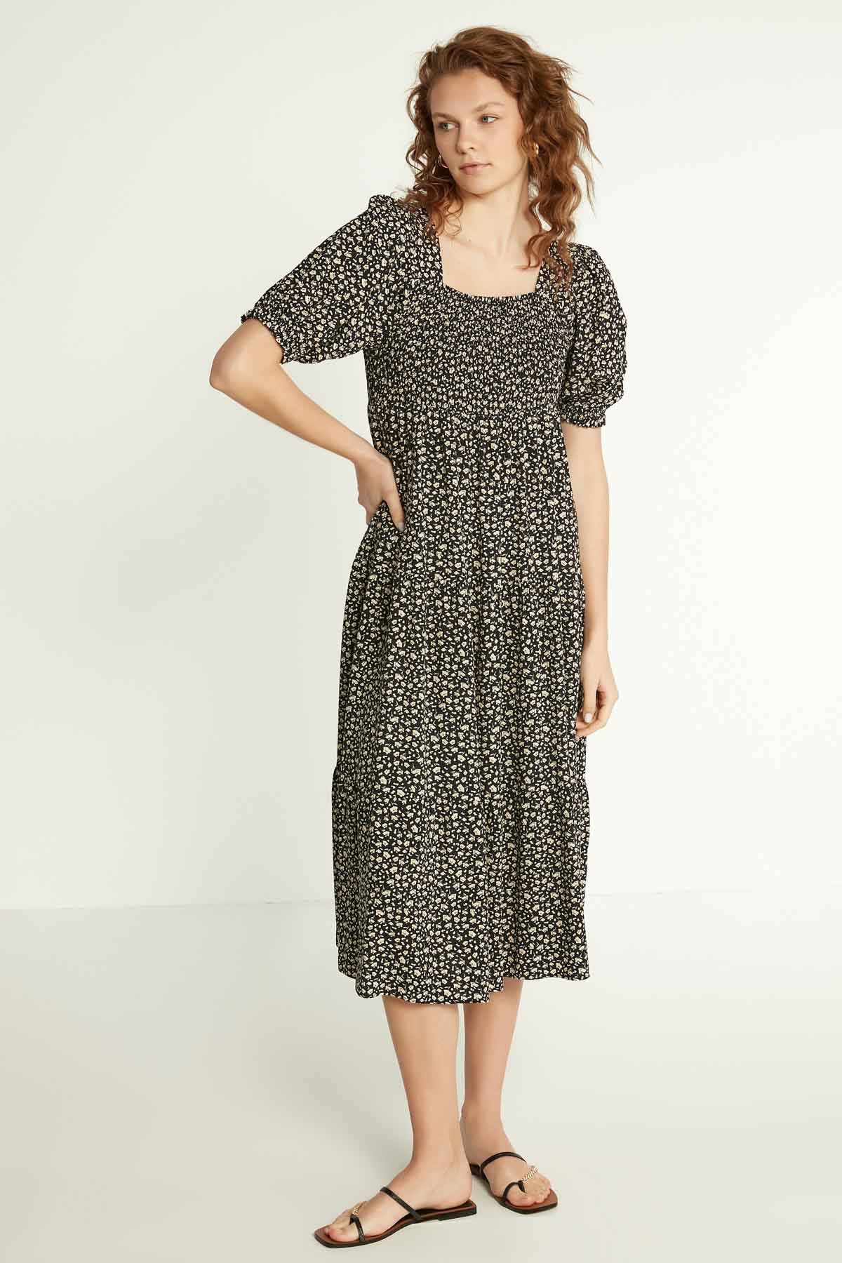 LONG DRESS WITH COILED SLEEVES AND FLORAL PATTERN