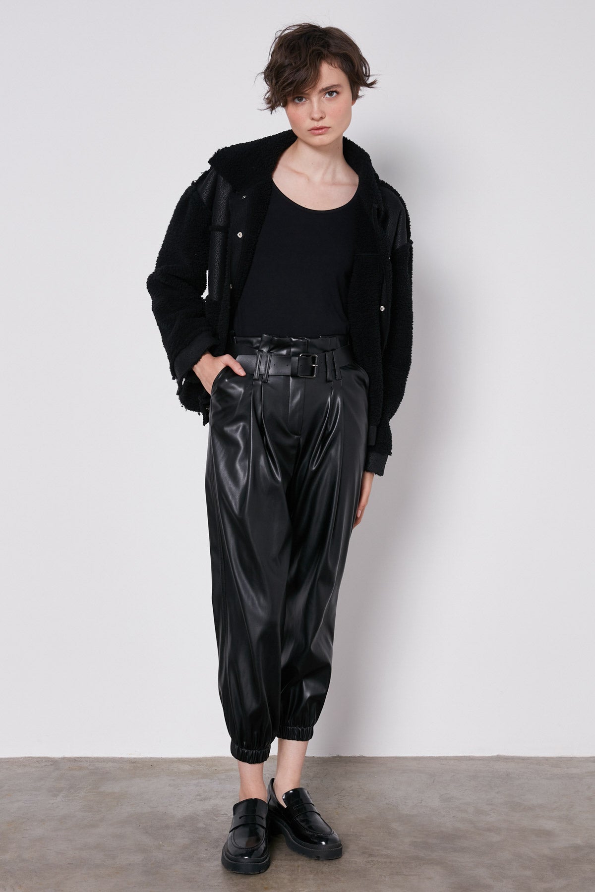 ARCHED BELT TRACK ELASTANE WAIST FAUX LEATHER TROUSERS