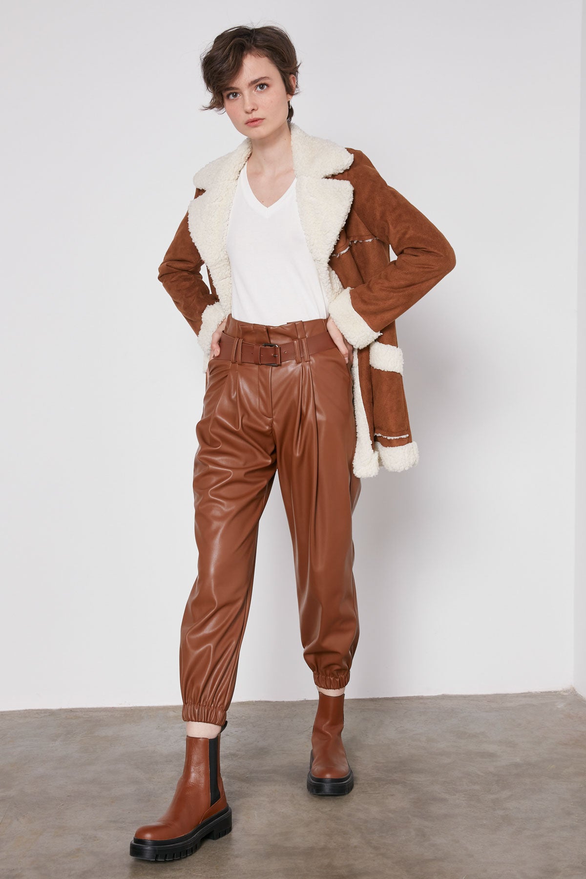 ARCHED BELT TRACK ELASTANE WAIST FAUX LEATHER TROUSERS