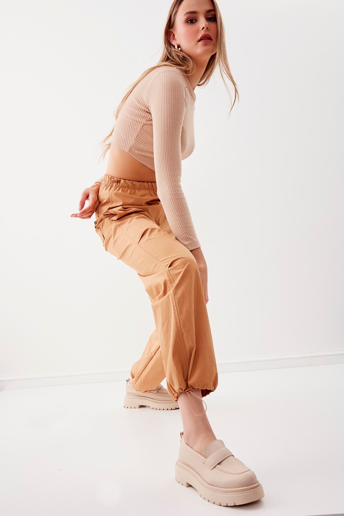 RUBBER-DETAILED PARACHUTE FABRIC TROUSERS
