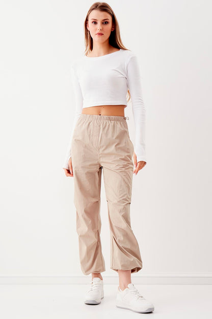 RUBBER-DETAILED PARACHUTE FABRIC TROUSERS