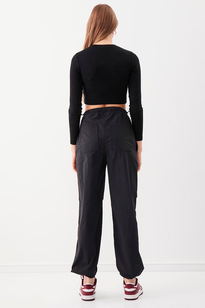 RUBBER-DETAILED PARACHUTE FABRIC TROUSERS