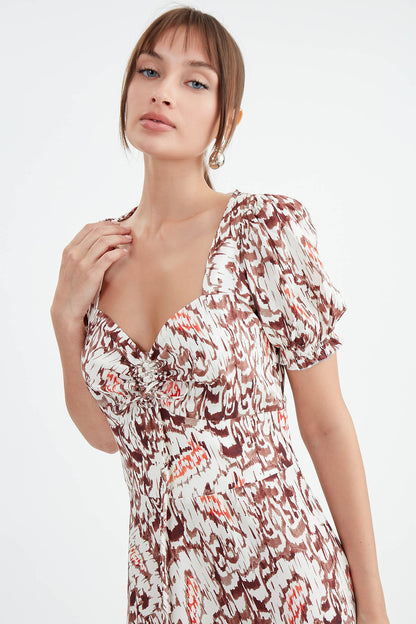 DRESS WITH CURVED FRONT