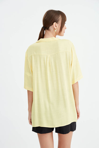 BLOUSE WITH NECK BUTTON BINDING