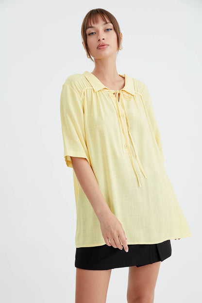 BLOUSE WITH NECK BUTTON BINDING