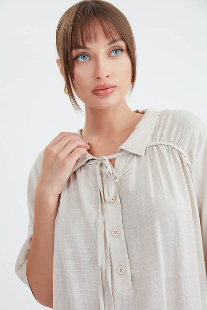 BLOUSE WITH NECK BUTTON BINDING