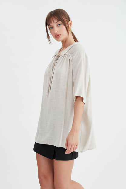 BLOUSE WITH NECK BUTTON BINDING