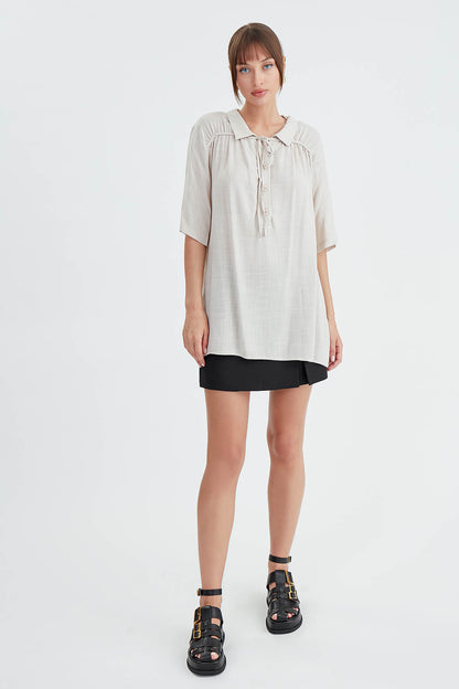 BLOUSE WITH NECK BUTTON BINDING
