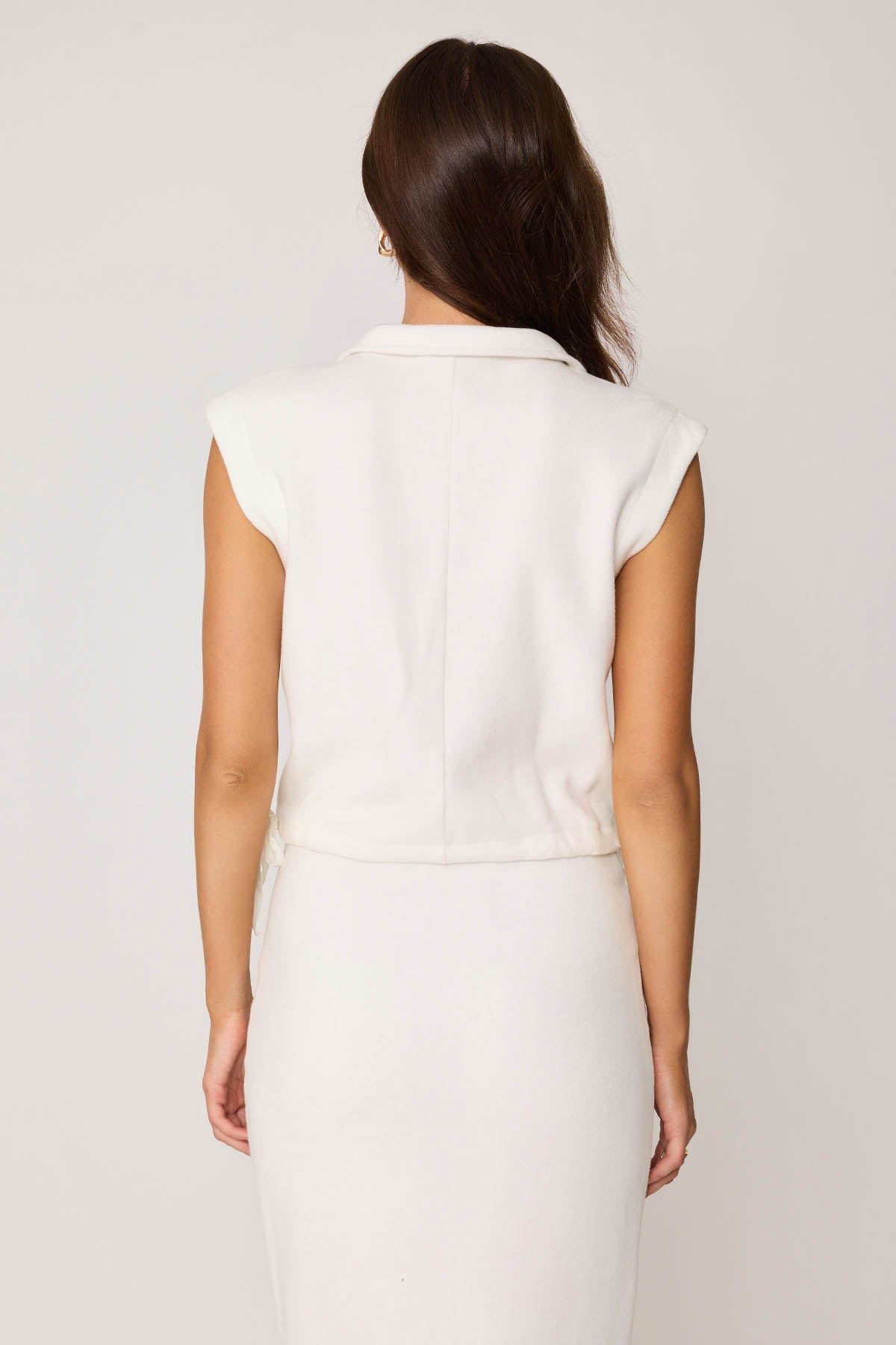 KNITTED VEST WITH WEDGE BUTTONS