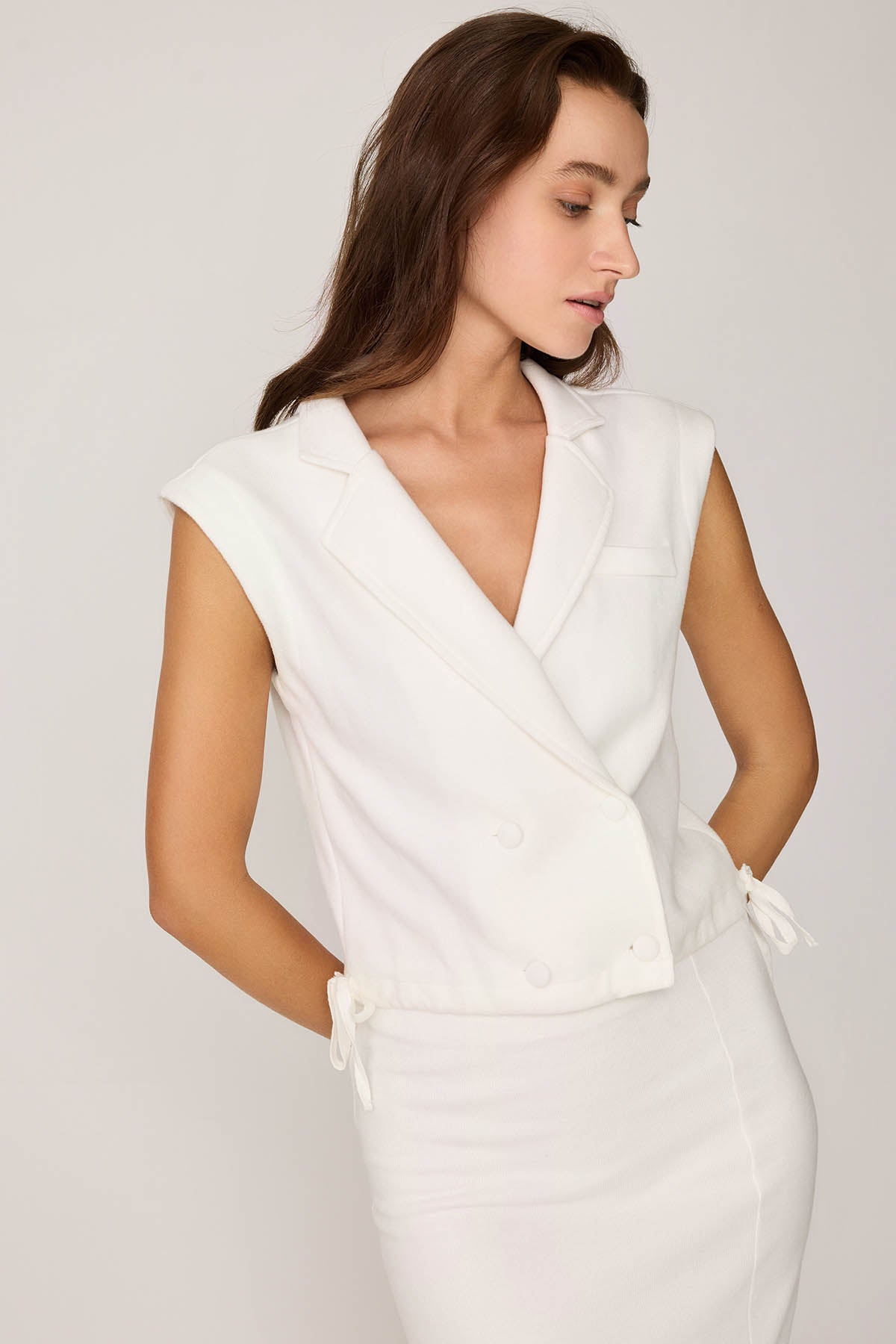 KNITTED VEST WITH WEDGE BUTTONS