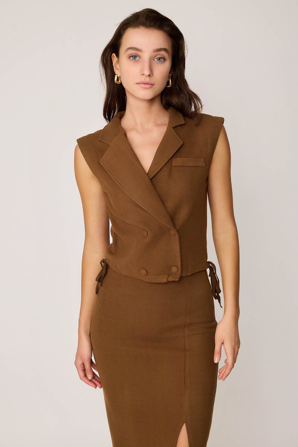 KNITTED VEST WITH WEDGE BUTTONS