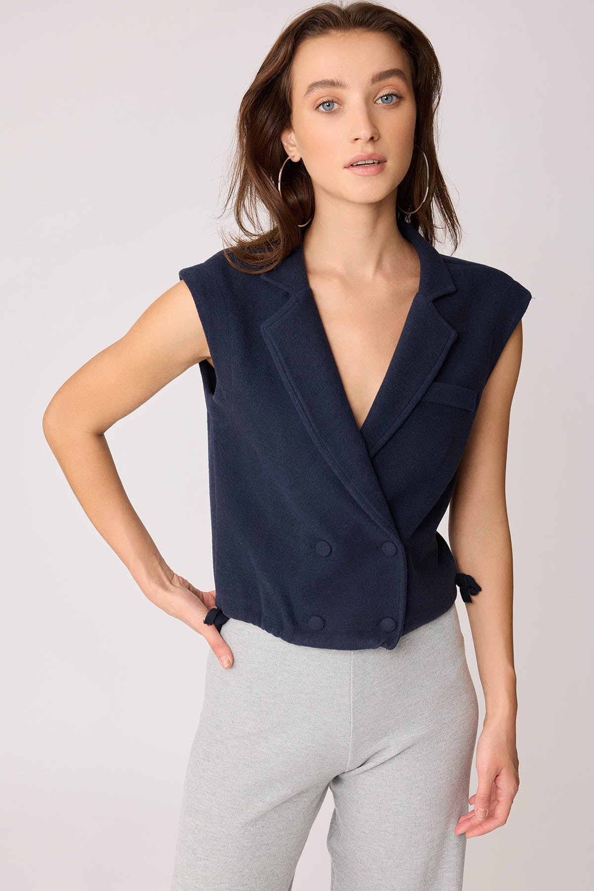 KNITTED VEST WITH WEDGE BUTTONS
