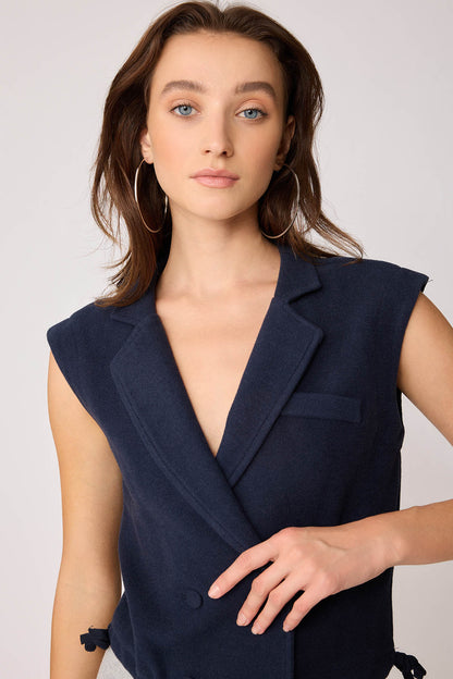 KNITTED VEST WITH WEDGE BUTTONS