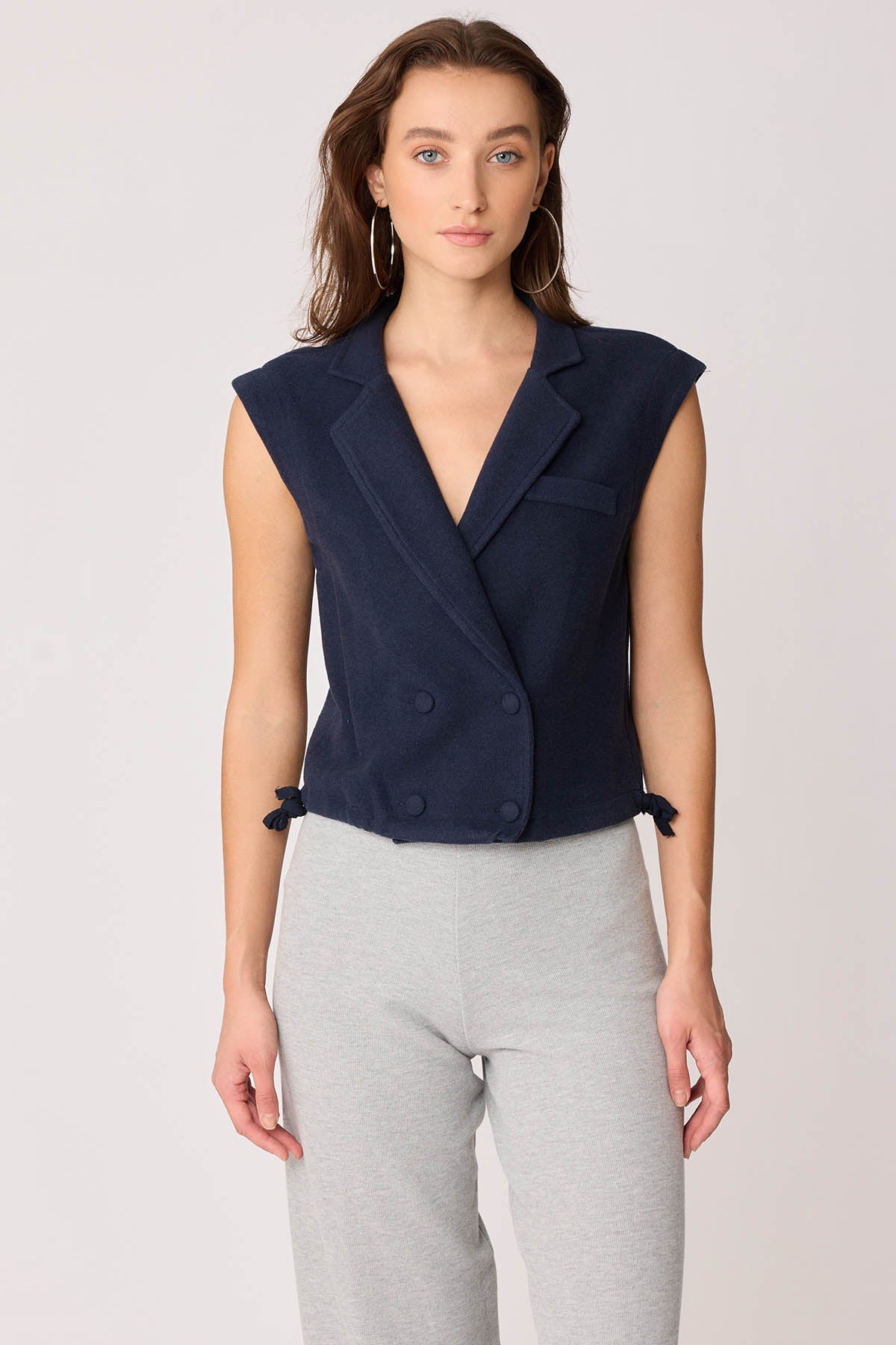 KNITTED VEST WITH WEDGE BUTTONS
