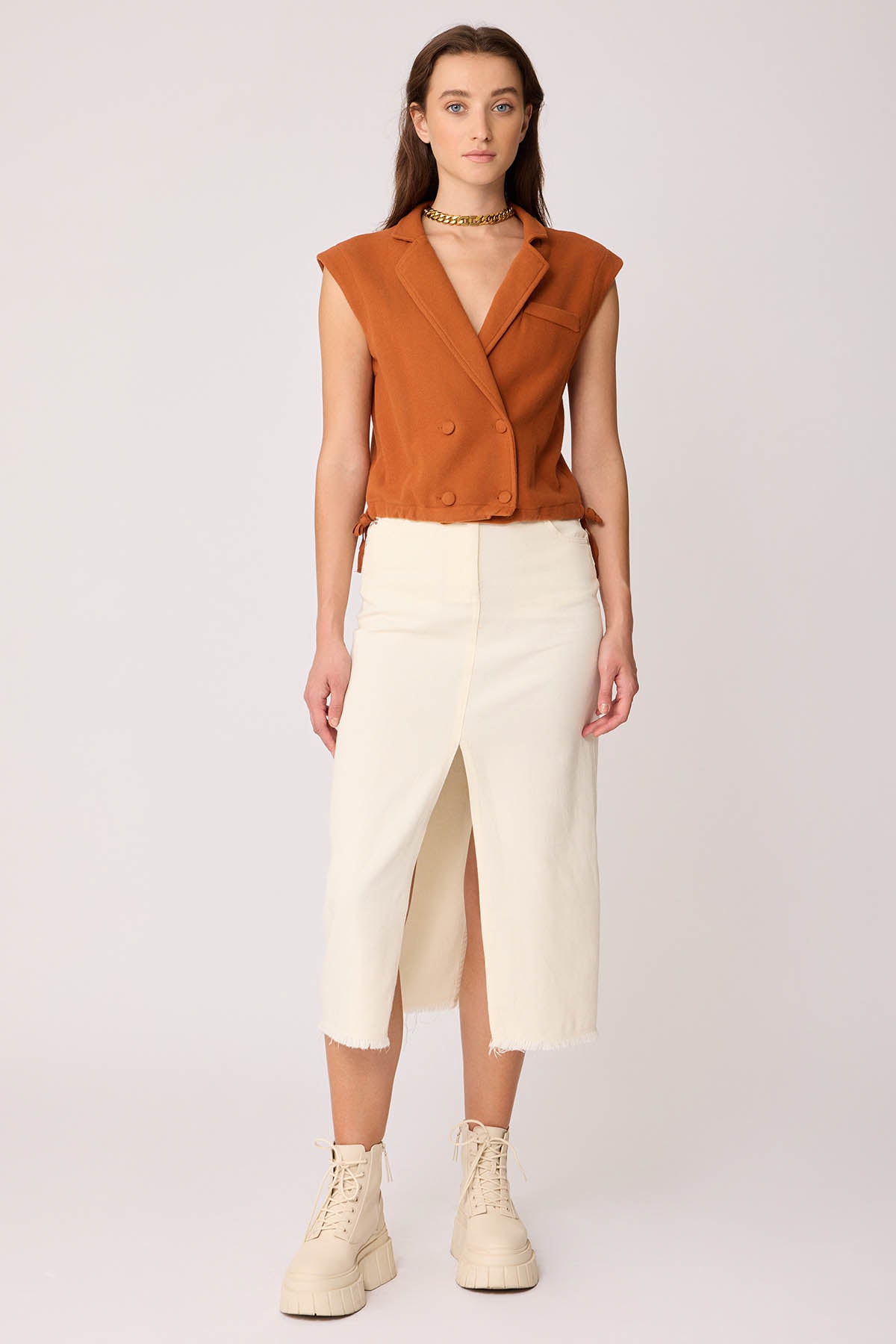 KNITTED VEST WITH WEDGE BUTTONS