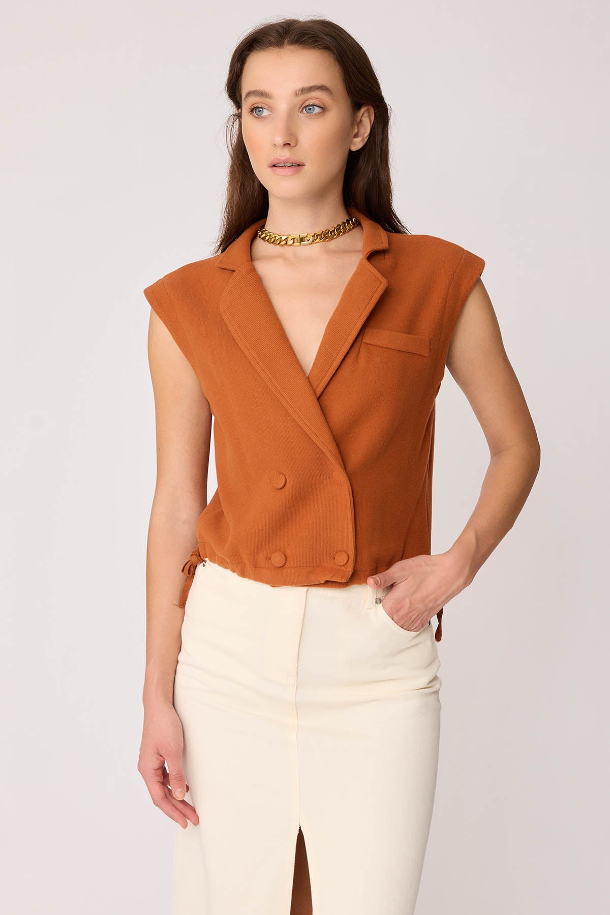 KNITTED VEST WITH WEDGE BUTTONS