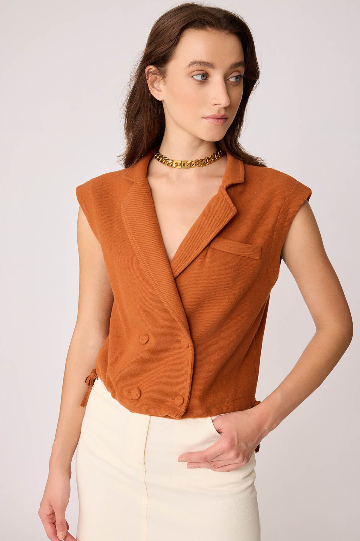 KNITTED VEST WITH WEDGE BUTTONS