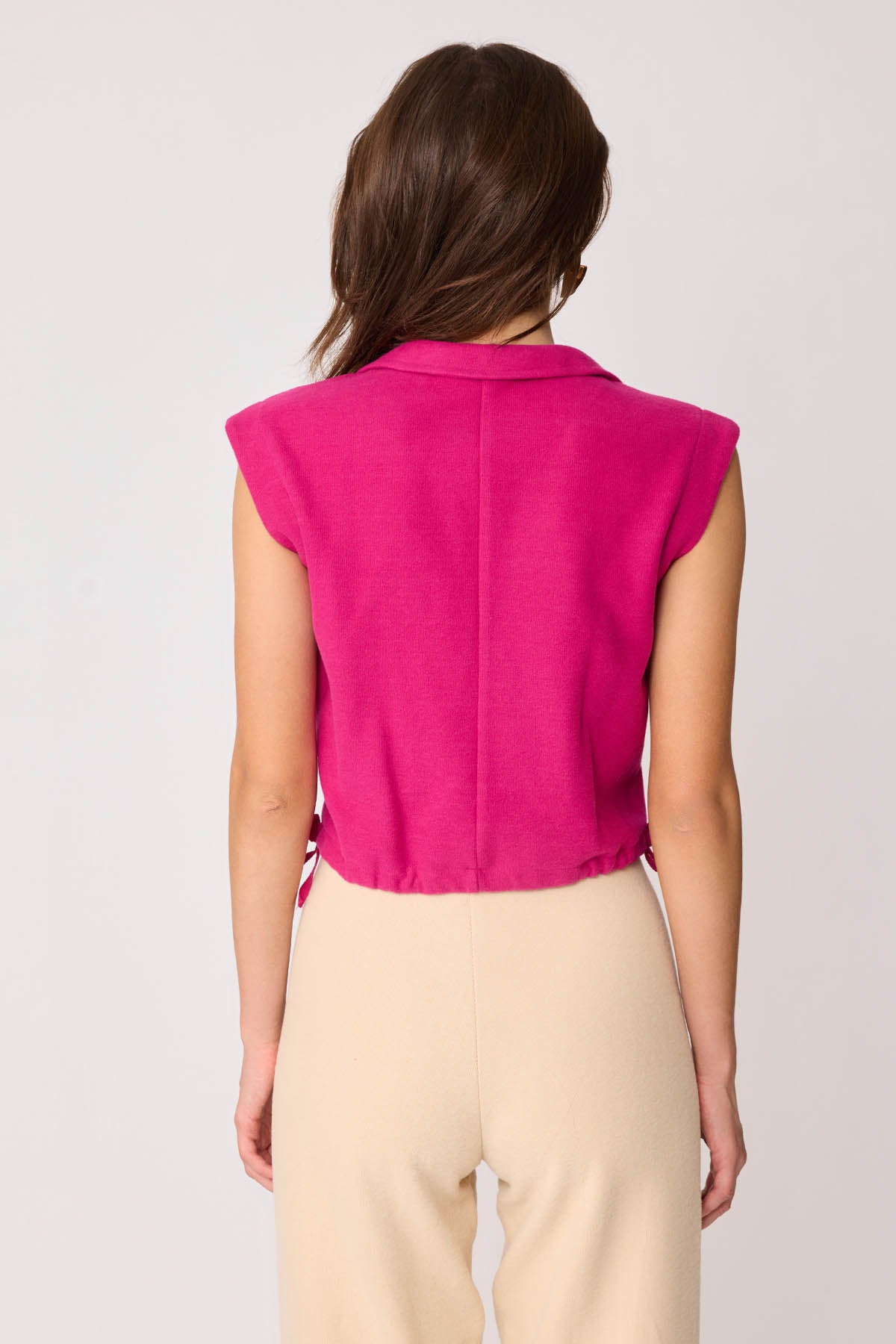 KNITTED VEST WITH WEDGE BUTTONS