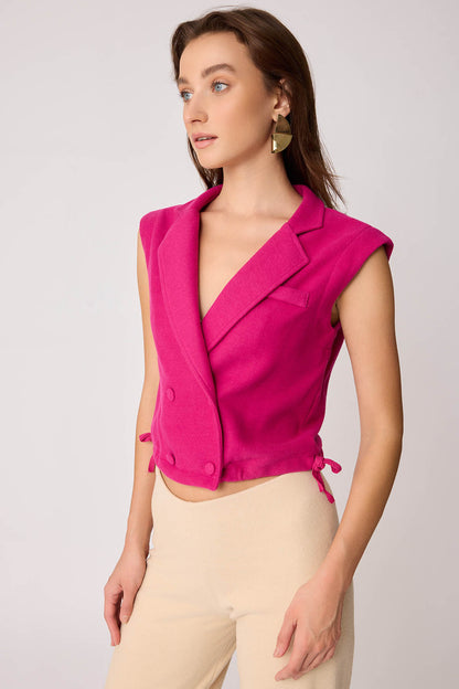 KNITTED VEST WITH WEDGE BUTTONS