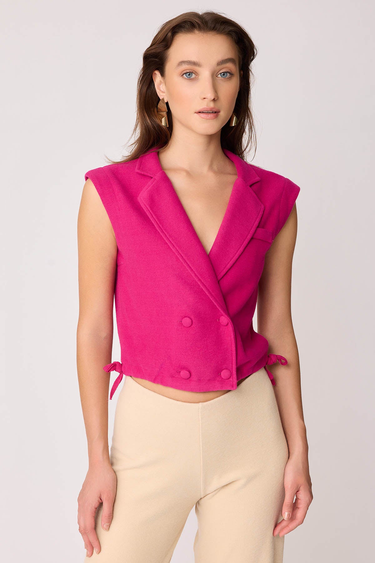 KNITTED VEST WITH WEDGE BUTTONS