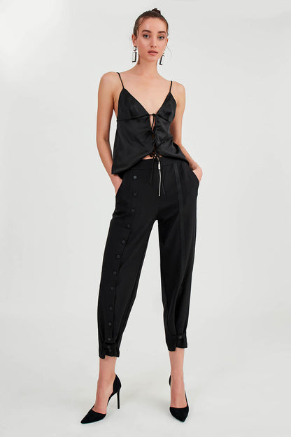 TROUSERS WITH ZIPPERED BUTTONS