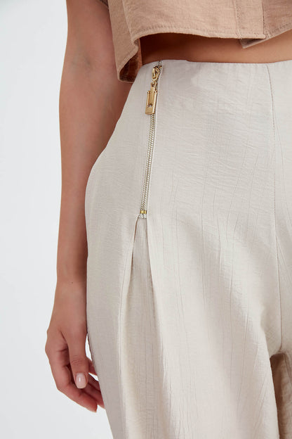 WIDE-ASPECT TROUSERS WITH ZIPPERED FRONT