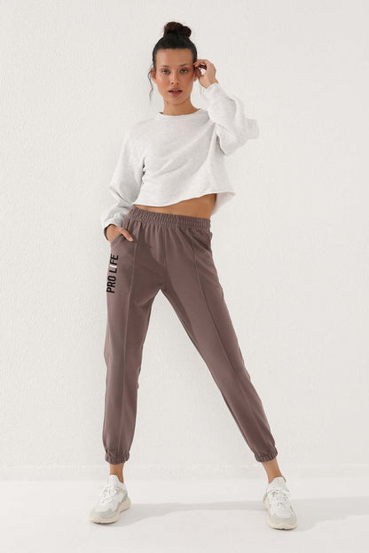 Women's Comfort Fit Elastic Cuff Embroidered Soil Writing Tracksuit Bottom - 94571