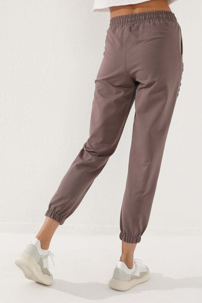 Women's Comfort Fit Elastic Cuff Embroidered Soil Writing Tracksuit Bottom - 94571