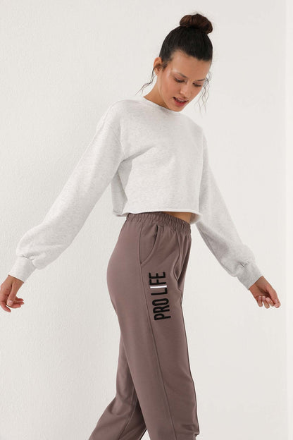 Women's Comfort Fit Elastic Cuff Embroidered Soil Writing Tracksuit Bottom - 94571