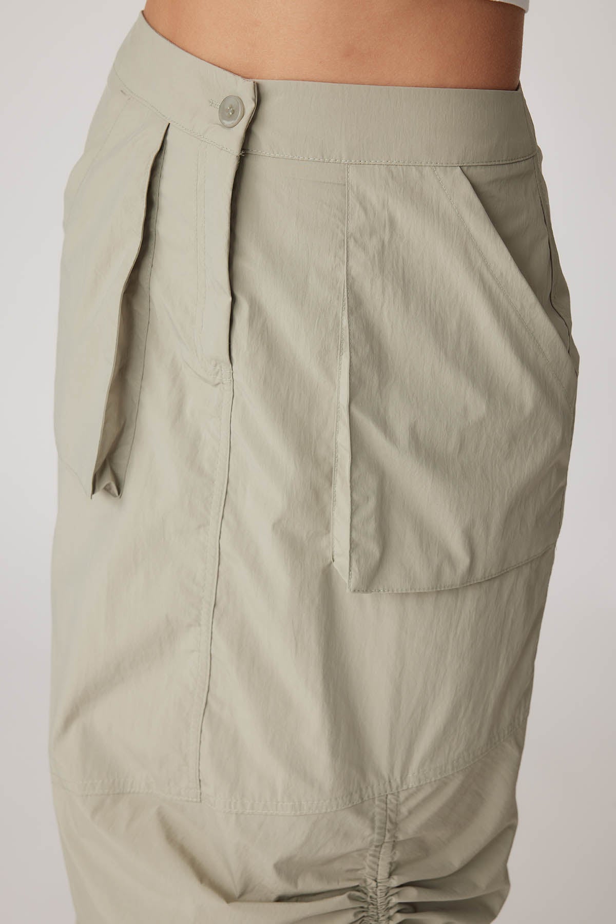 PARACHUTE FABRIC FRONT CURVED POCKET SKIRT