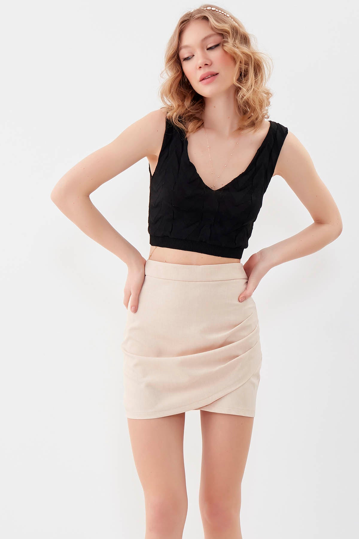MINI-SKIRT WITH THE BRUSTS